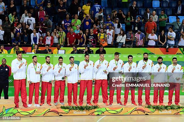Bronze medallists Spain's centre Pau Gasol, Spain's small forward Rudy Fernandez, Spain's point guard Sergio Rodriguez, Spain's guard Juan-Carlos...
