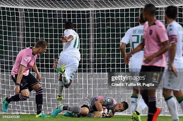 Gregoire Defrel of Sassuolo jumps as Josip Posavec goalgeeper of Palermo saves the goal during the Serie A match between US Citta di Palermo and US...