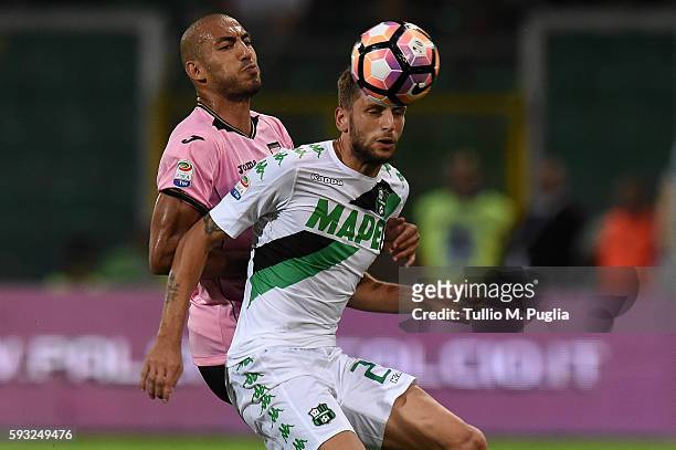 Haitam Aleesami of Palermo and Domenico Berardi of Sassuolo compete for the ball during the Serie A match between US Citta di Palermo and US Sassuolo...