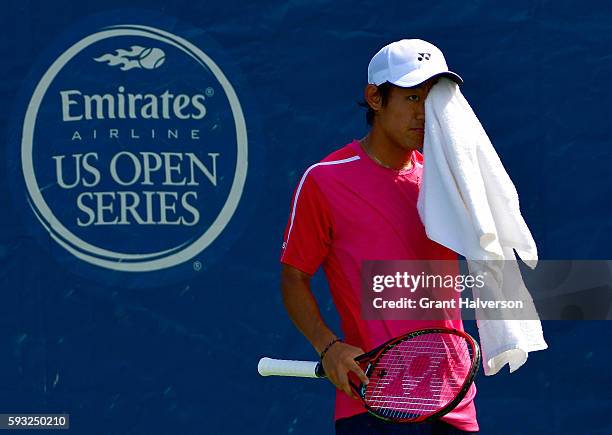 Yoshihito Nishioka of Japan pauses in his match against Liam Brody of Great Britain during the Winston-Salem Open at Wake Forest University on August...