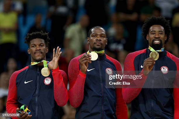 Gold medalists Jimmy Butler, Kevin Durant, and DeAndre Jordan of the United States stand on the podium after defeating Serbia in the Men's Gold medal...