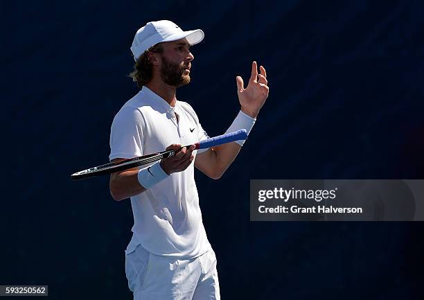 Liam Broady of Great Britain questions a call by the chair umpire in his match against Yoshihito Nishioka of Japan during the Winston-Salem Open at...