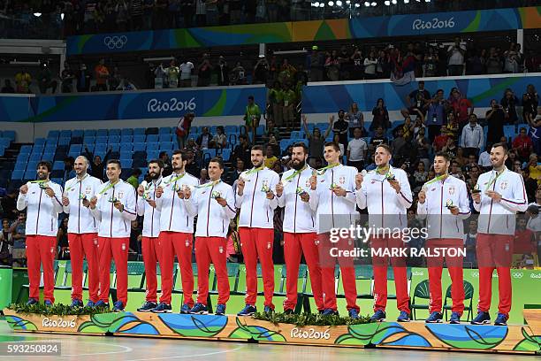 Silver medallists Serbia's guard Milos Teodosic, Serbia's forward Marko Simonovic, Serbia's shooting guard Bogdan Bogdanovic, Serbia's point guard...