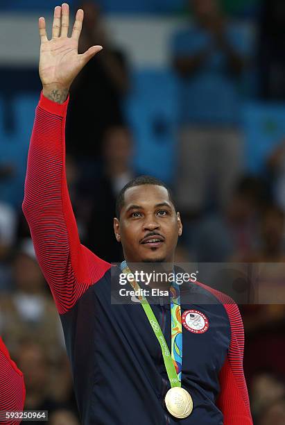 Gold medalist Carmelo Anthony of the United States reacts on the podium after defeating Serbia in the Men's Gold medal game on Day 16 of the Rio 2016...