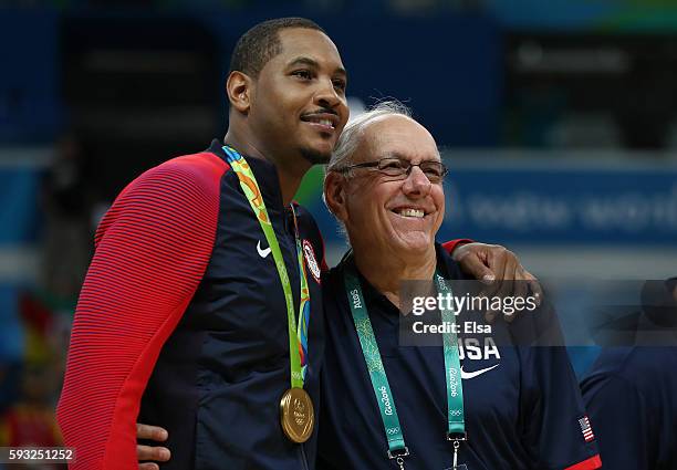 Carmelo Anthony of the United States poses with Team USA assistant coach Jim Boeheim after defeating Serbia in the Men's Gold medal game on Day 16 of...