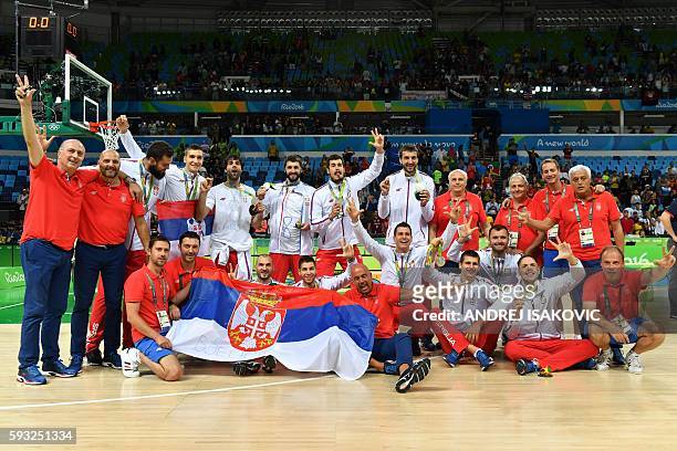 Silver medallists Serbia's guard Milos Teodosic, Serbia's forward Marko Simonovic, Serbia's shooting guard Bogdan Bogdanovic, Serbia's point guard...