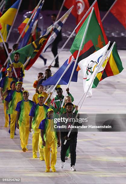 Flag bearer Popole Misenga of the Refugee Olympic Team parades in the 'Heroes of the Games' segment during the Closing Ceremony on Day 16 of the Rio...