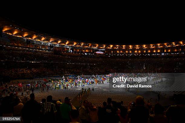 Athletes walk during the "Heroes of the Games" segment during the Closing Ceremony on Day 16 of the Rio 2016 Olympic Games at Maracana Stadium on...