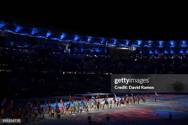 Athletes walk during the "Heroes of the Games" segment during the Closing Ceremony on Day 16 of the Rio 2016 Olympic Games at Maracana Stadium on...