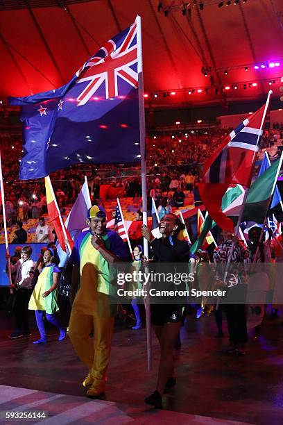 Flag bearer Lisa Carrington of New Zealand walks during the 'Heroes of the Games' segment during the Closing Ceremony on Day 16 of the Rio 2016...