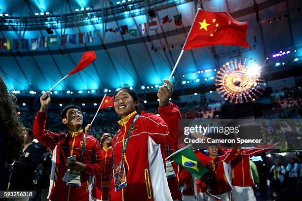 Team China walks in the 'Heroes of the Games' segment during the Closing Ceremony on Day 16 of the Rio 2016 Olympic Games at Maracana Stadium on...