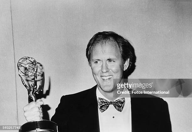 Actor John Lithgow holding his Emmy Award for his role in 'Amazing Stories', at the Pasadena Civic Auditorium, Los Angeles, September 21st 1986.