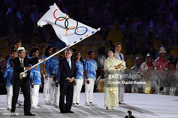 President Thomas Bach and Governor of Tokyo Yuriko Koike stand on stage for the Flag Handover Ceremony during the Closing Ceremony on Day 16 of the...