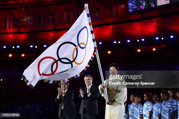 Mayor of Rio de Janeiro Eduardo Paes, IOC President Thomas Bach and Governor of Tokyo Yuriko Koike take part in the Flag Handover Ceremony during the...