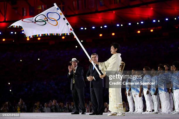 Mayor of Rio de Janeiro Eduardo Paes, IOC President Thomas Bach and Governor of Tokyo Yuriko Koike take part in the Flag Handover Ceremony during the...