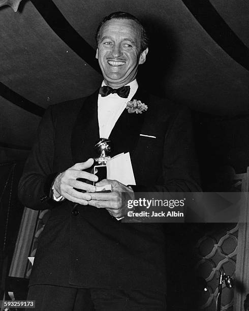 Actor David Niven with his Best Actor award at the Foreign Press Awards, or the Golden Globes, in Hollywood, 1959.