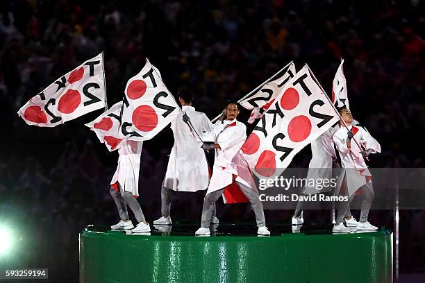Dancers perform during the 'Love Sport Tokyo 2020' segment during the Closing Ceremony on Day 16 of the Rio 2016 Olympic Games at Maracana Stadium on...