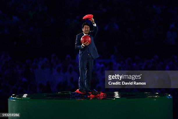 Japan Prime Minister Shinzo Abe appears during the 'Love Sport Tokyo 2020' segment during the Closing Ceremony on Day 16 of the Rio 2016 Olympic...