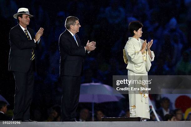 Mayor of Rio de Janeiro Eduardo Paes, IOC President Thomas Bach and Governor of Tokyo Yuriko Koike take part in the Flag Handover Ceremony during the...