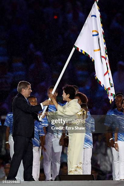 President Thomas Bach and Governor of Tokyo Yuriko Koike take part in the Flag Handover Ceremony during the Closing Ceremony on Day 16 of the Rio...