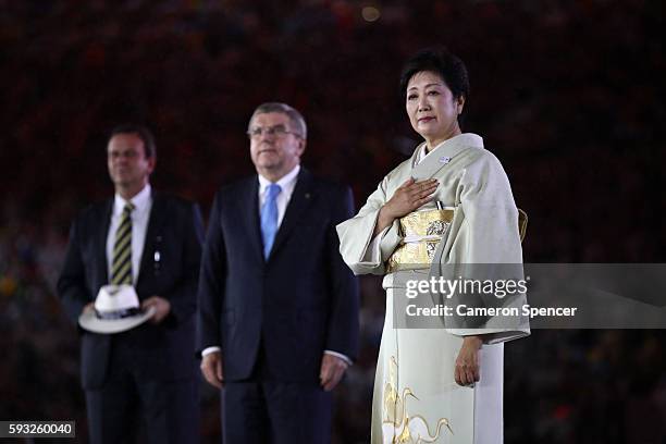 Mayor of Rio de Janeiro Eduardo Paes, IOC President Thomas Bach and Governor of Tokyo Yuriko Koike take part in the Flag Handover Ceremony during the...