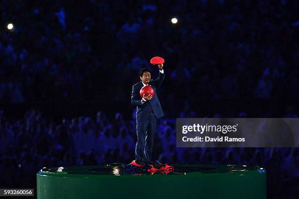 Japan Prime Minister Shinzo Abe appears during the 'Love Sport Tokyo 2020' segment during the Closing Ceremony on Day 16 of the Rio 2016 Olympic...