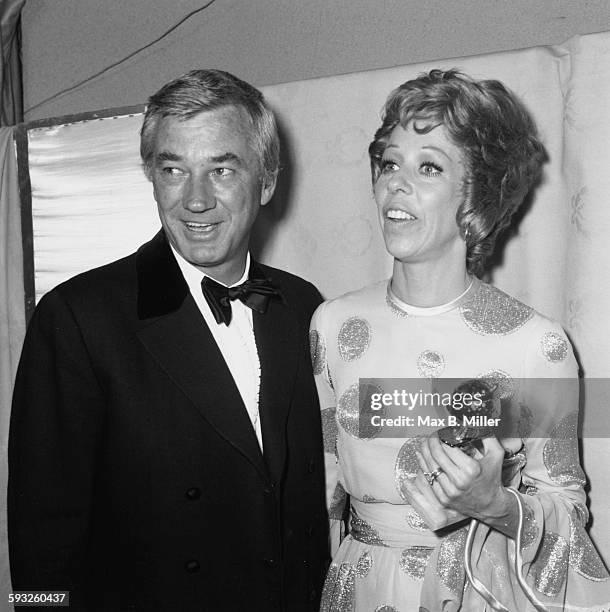 Actress Carol Burnett holding her award, with her husband at the Golden Globes, Los Angeles, February 1971.