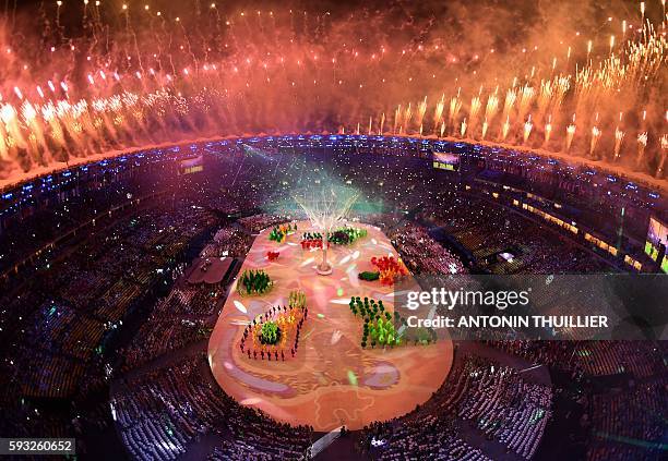 This picture shows an overview of fireworks during the closing ceremony of the Rio 2016 Olympic Games at the Maracana stadium in Rio de Janeiro on...