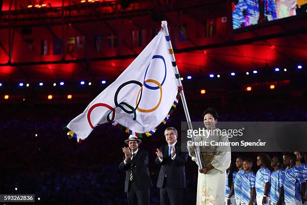 Mayor of Rio de Janeiro Eduardo Paes, IOC President Thomas Bach and Governor of Tokyo Yuriko Koike take part in the Flag Handover Ceremony during the...