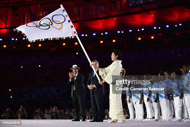 Mayor of Rio de Janeiro Eduardo Paes, IOC President Thomas Bach and Governor of Tokyo Yuriko Koike take part in the Flag Handover Ceremony during the...