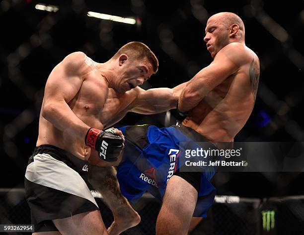 Donald Cerrone lands a knee to the body of Rick Story in their welterweight bout during the UFC 202 event at T-Mobile Arena on August 20, 2016 in Las...