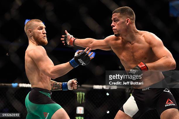Nate Diaz attempts to strike Conor McGregor of Ireland in their welterweight bout during the UFC 202 event at T-Mobile Arena on August 20, 2016 in...