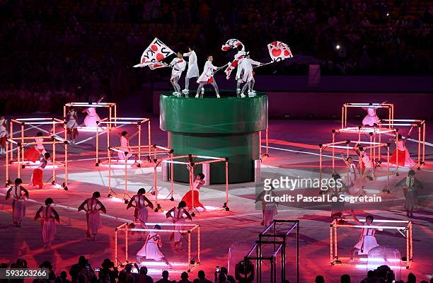 Dancers perform at the 'Love Sport Tokyo 2020' segment during the Closing Ceremony on Day 16 of the Rio 2016 Olympic Games at Maracana Stadium on...