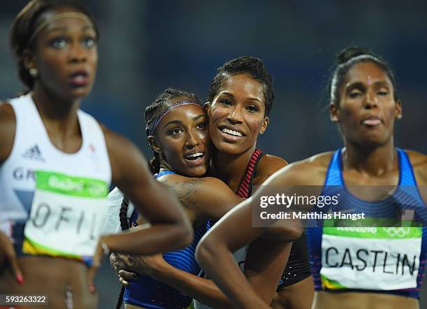Brianna Rollins of the United States celebrates her gold medal with Phylicia George of Canada in the Women's 100 metres hurdles final on Day 12 of...