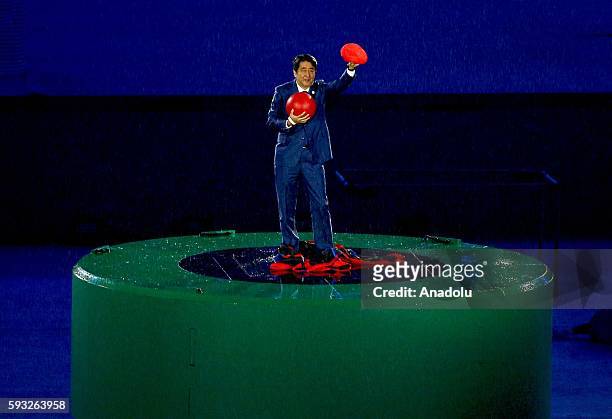 Japan Prime Minister Shinzo Abe is seen during the 'Love Sport Tokyo 2020' segment during the Closing Ceremony on Day 16 of the Rio 2016 Olympic...