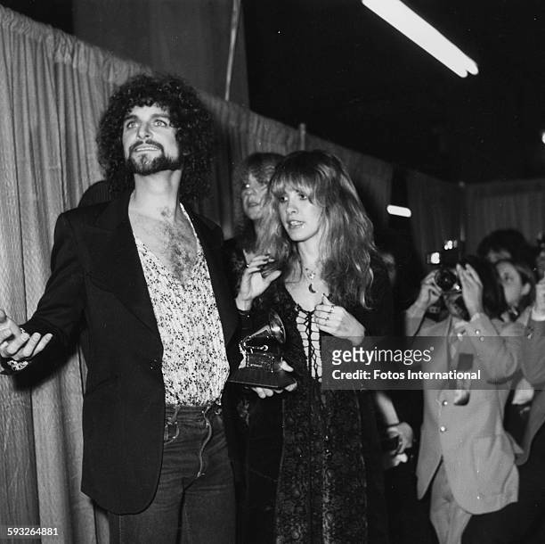 Musicians Lindsey Buckingham and Stevie Nix , members of the band 'Fleetwood Mac', with their award at the Grammy Awards, February 1978.