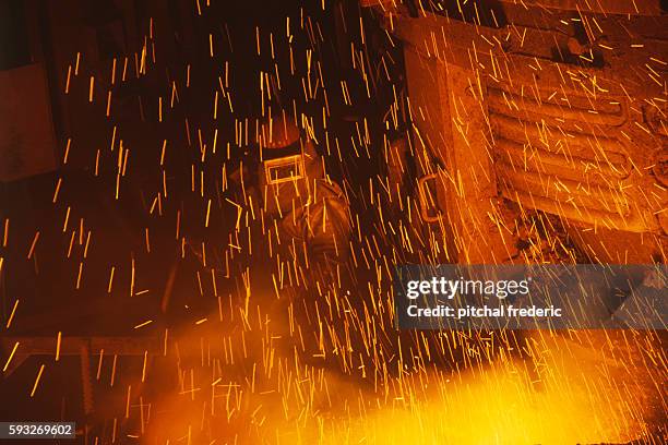 Steel being manufactured from recuperated steel. SOLLAC stands for Société Lorraine de Laminage Continu.