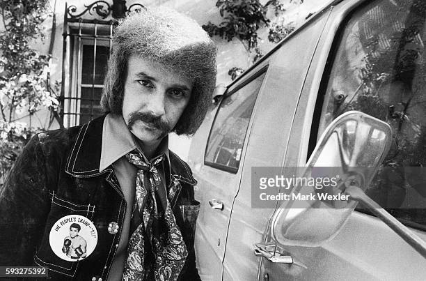 Rock & Roll songwriter and record producer, Phil Spector stands next to his vehicle . On February 3 Phil Spector, age 62, known for his creation of...