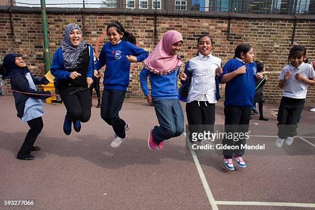 Children at Marner Primary School in Tower Hamlets enjoy a skipping game during their playtime. This is one of the schools close to the site of the...