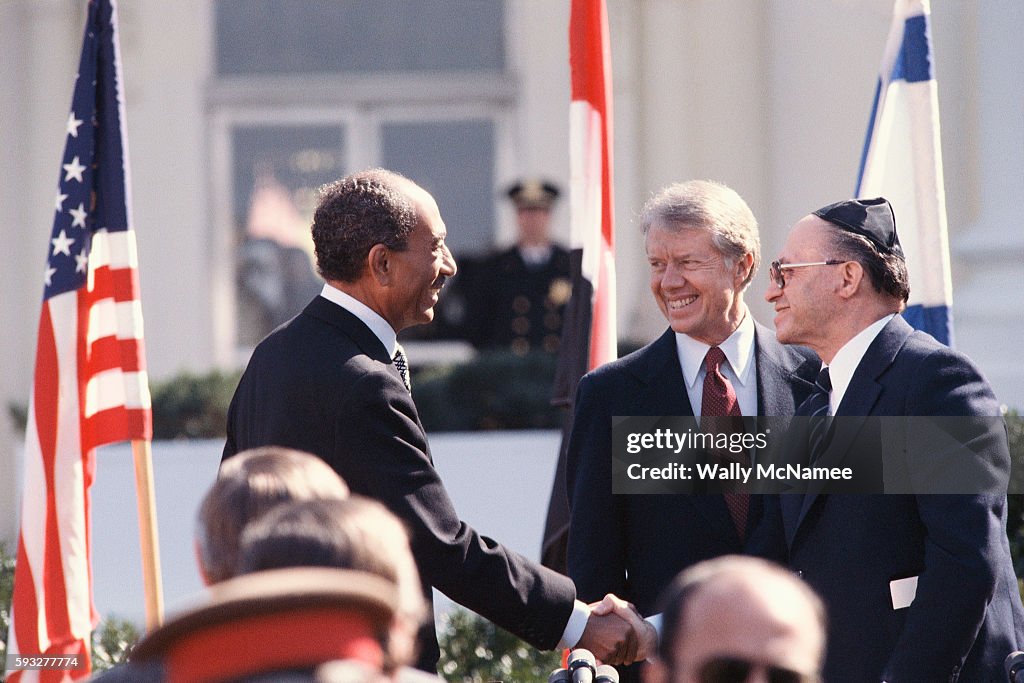 Shaking hands at the signing of the Camp David Accords