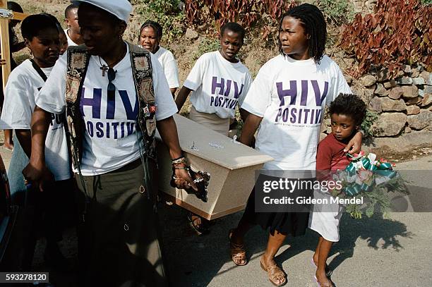 Members carry the coffin of Ncane Surprise Xulu, a fellow TAC activist who had not received anti-retroviral therapy and died of AIDS-related...