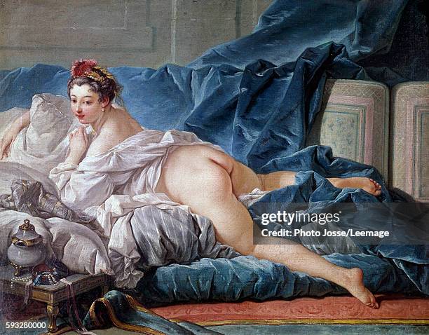 The odalisque. Young woman almost nude on a sofa. Painting by Francois Boucher , 1745. 0,53 x 0,64 m. Louvre Museum, Paris