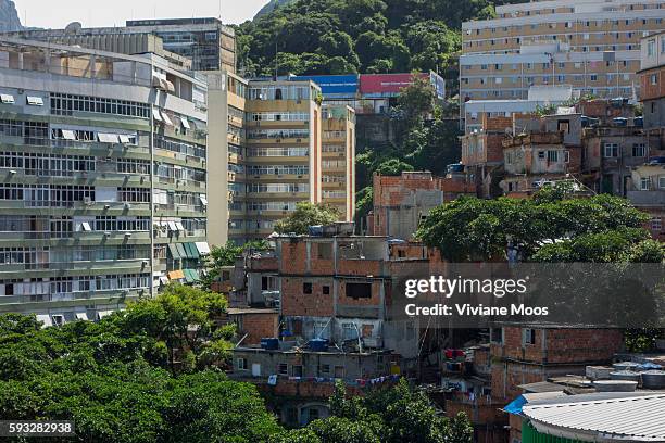 View inside the favela Cantagalo looking at the top of the hill. New high rises for living apartments and construction surround the old, traditional...
