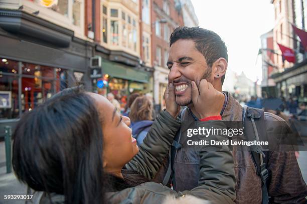 tourists having fun on grafton street, dublin - grafton street stockfoto's en -beelden