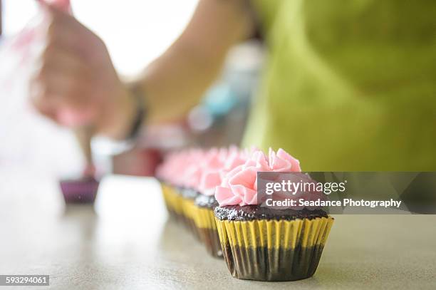 decorating cupcakes - comox bc stock pictures, royalty-free photos & images