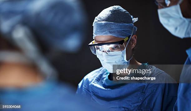 focused in an intense and emotional situation - surgeon stock pictures, royalty-free photos & images