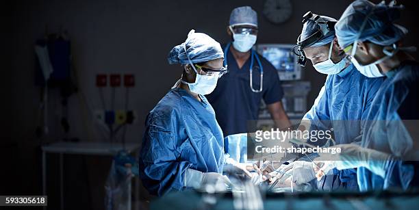 putting their skills to good use - surgery stock pictures, royalty-free photos & images