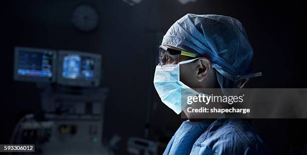 thinking about the proper decision - surgeon stock pictures, royalty-free photos & images