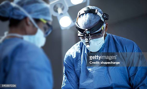 working to save lives - operation theatre stock pictures, royalty-free photos & images