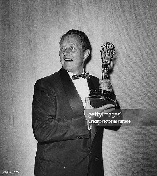 Television personality Art Linkletter holding a statuette as he presents the Primetime Emmy Awards, circa 1955.